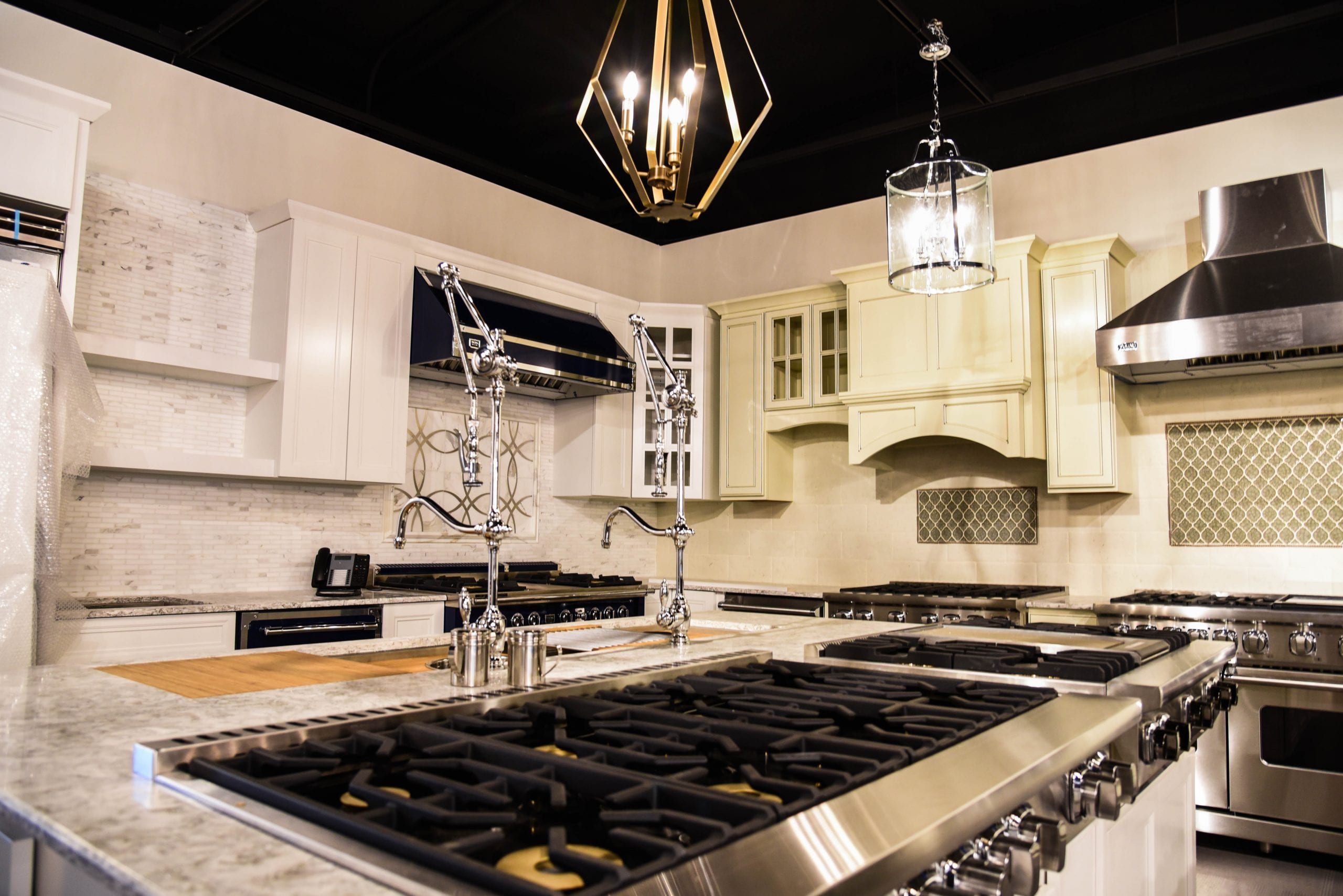 Beautiful kitchen with farmhouse lighting and Facets of Lafayette Kitchen Appliances