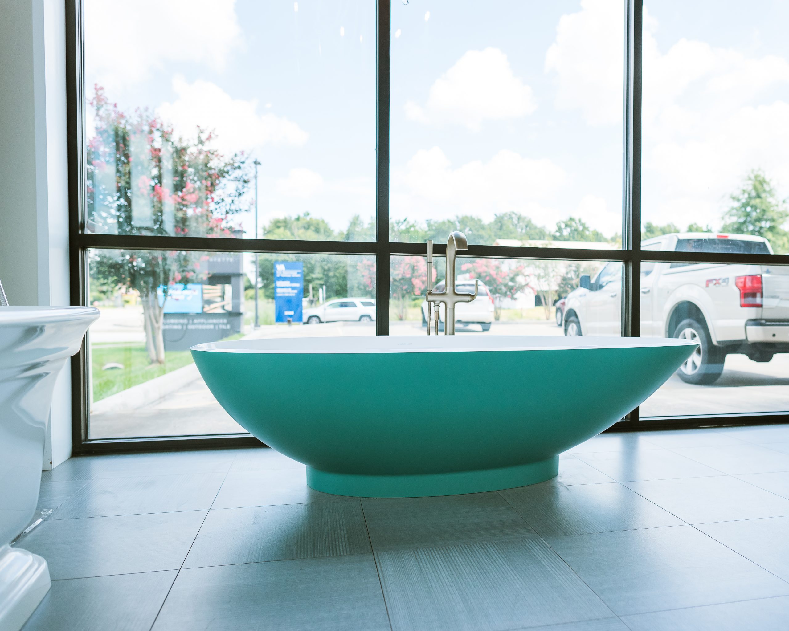 a green bathtub at a showroom