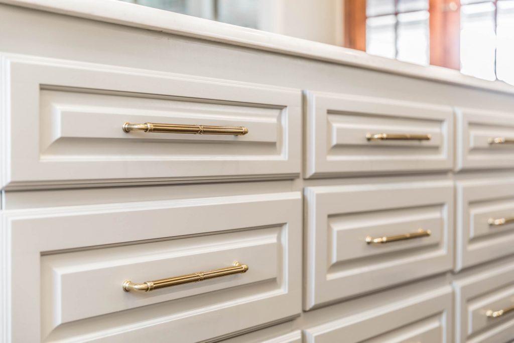 gold pulls on white cabinets
